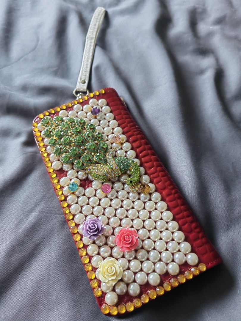 Long Wallet with Pearl and Peacock Design (Category: Wallets & Card holders) located in Manila. Submitted by twinkle_love (Listing ID 1415123019, Image 2). Description: - Red long wallet with a pearl and peacock design - Secure zipper closure - Multiple compartments for cards and cash - Interior zippered pocket for valuables.