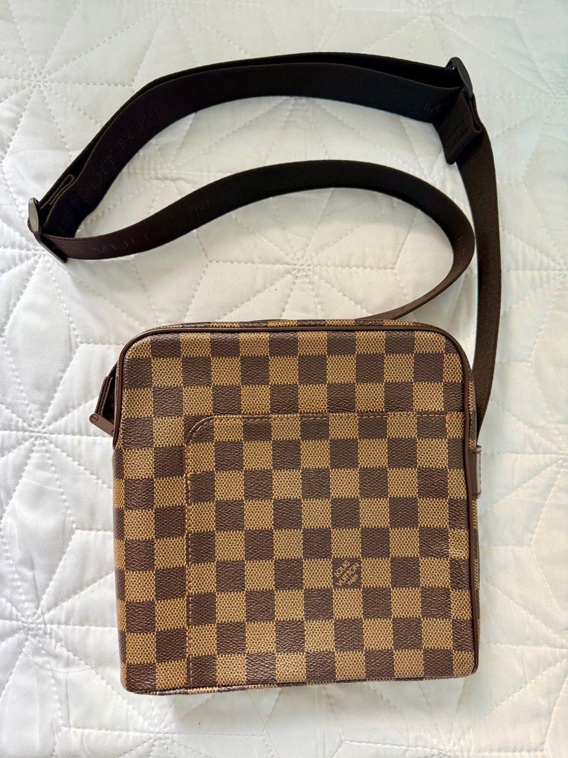 Louis Vuitton Damier Ebene Crossbody Bag (Category: Luxury Bags & Wallets) located in Imus. Submitted by krstn18 (Listing ID 1414201865, Image 2). Description: Brand: Louis Vuitton Damier Ebene Style: Unisex small crossbody / messenger bag Rank: A Made in Spain Highlights * damier ebene coated canvas body with leather trim * adjustable flat strap * top zip closure * front exterior slip pocket * interior slip pocket * brown * Serial Number: LM0026