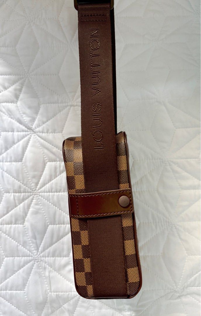 Louis Vuitton Damier Ebene Crossbody Bag (Category: Luxury Bags & Wallets) located in Imus. Submitted by krstn18 (Listing ID 1414201865, Image 3). Description: Brand: Louis Vuitton Damier Ebene Style: Unisex small crossbody / messenger bag Rank: A Made in Spain Highlights * damier ebene coated canvas body with leather trim * adjustable flat strap * top zip closure * front exterior slip pocket * interior slip pocket * brown * Serial Number: LM0026