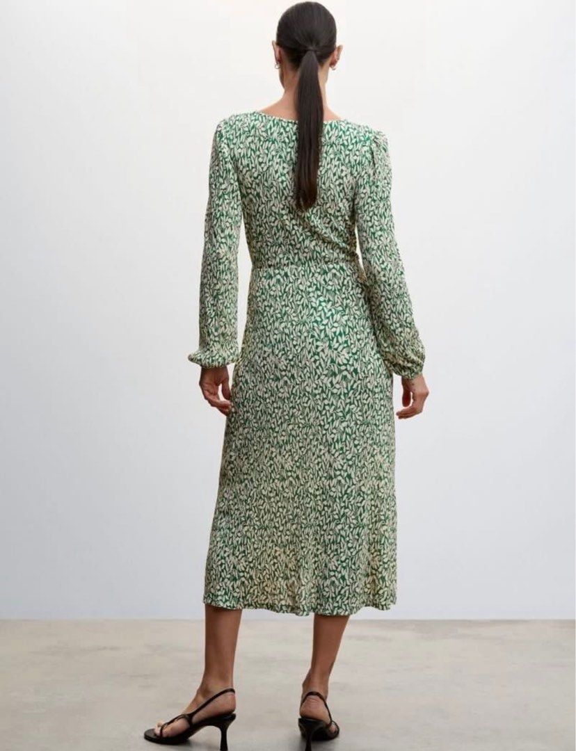 Mango Green Floral Midi Dress (Category: Dresses) located in Manila. Submitted by cluttercleanwme (Listing ID 1415215143, Image 3). Description: - Mango midi dress - V-neck design - Long sleeves with cuffs - Wrap-style silhouette - Green and cream floral pattern - Flowing skirt, mid-calf length - Suitable for casual and semi-formal events.