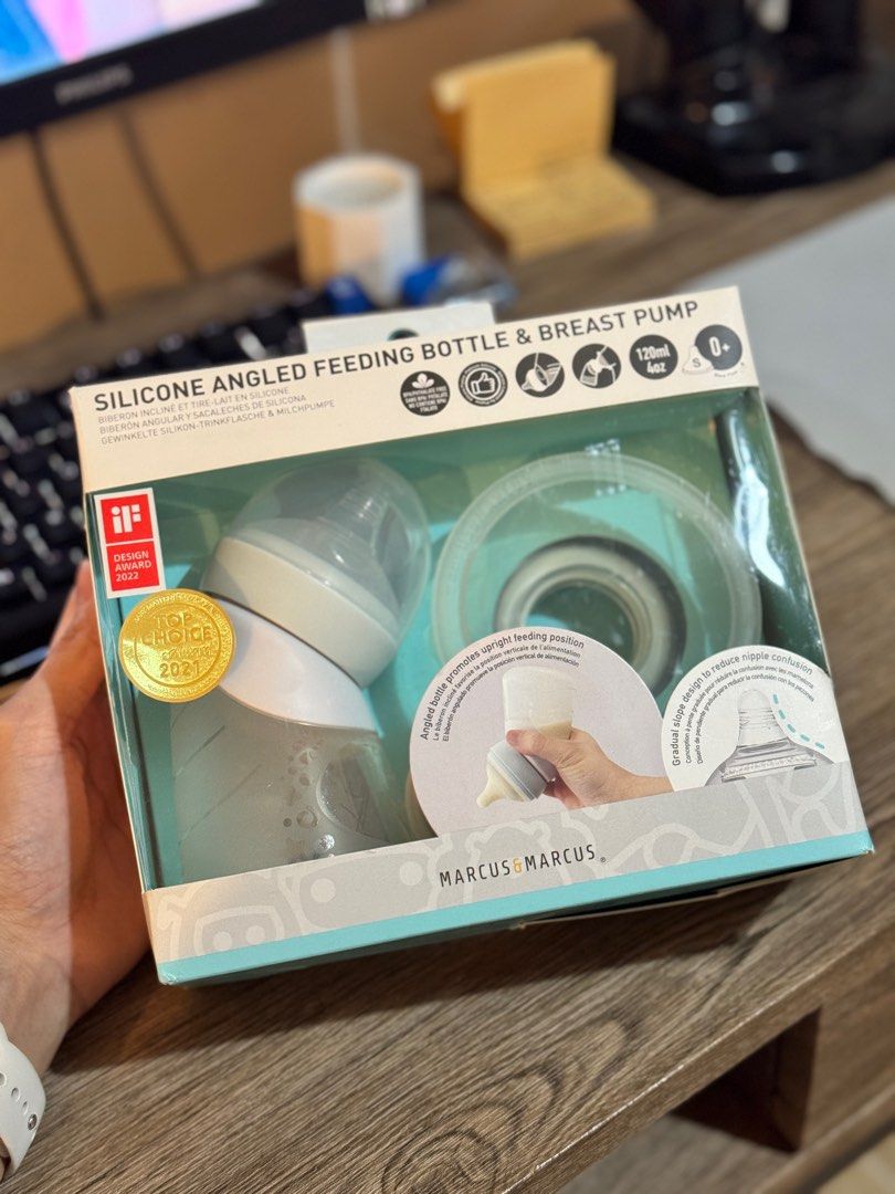 Marcus Marcus Silicone Angled Feeding Bottle & Breast Pump (Category: Breastfeeding & Bottle Feeding) located in Marikina City. Submitted by meowmingsksk (Listing ID 1415227482, Image 2). Description: - Marcus Marcus Angled Feeding Bottle & Breast Pump Set - For babies 0+ months - 120ml capacity - Includes bottle, breast pump component, and accessories - Angled silicone design - iF Design Award 2022 winner Note: • Few times ko lang nagamit kapag 