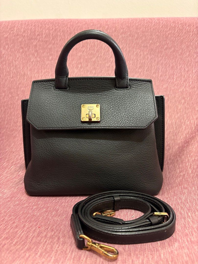 MCM Milla Small Leather Crossbody (Category: Luxury Bags & Wallets) located in Manila. Submitted by rvcr1694 (Listing ID 1415094664, Image 2). Description: MCM Milla Small Leather Crossbody Preloved, used good condition With normal wear and tear * Top handle, detachable adjustable crossbody strap * Turnlock flap closure; lined * Exterior slip pocket, interior slip pocket * 8.5”W x 4”D x 8”H; 2” handle drop, 22” strap drop * First photo for refere