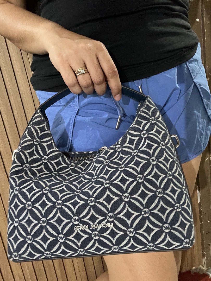 Michael Kors Ember Denim Hobo Bag (Category: Luxury Bags & Wallets) located in Davao. Submitted by mydearest20 (Listing ID 1415219719, Image 1). Description: 100%Legit Original and legit from store talaga Used 1-2 lng for an hour/minutes pala Maganda to promise unique style Handbag and sling bag.