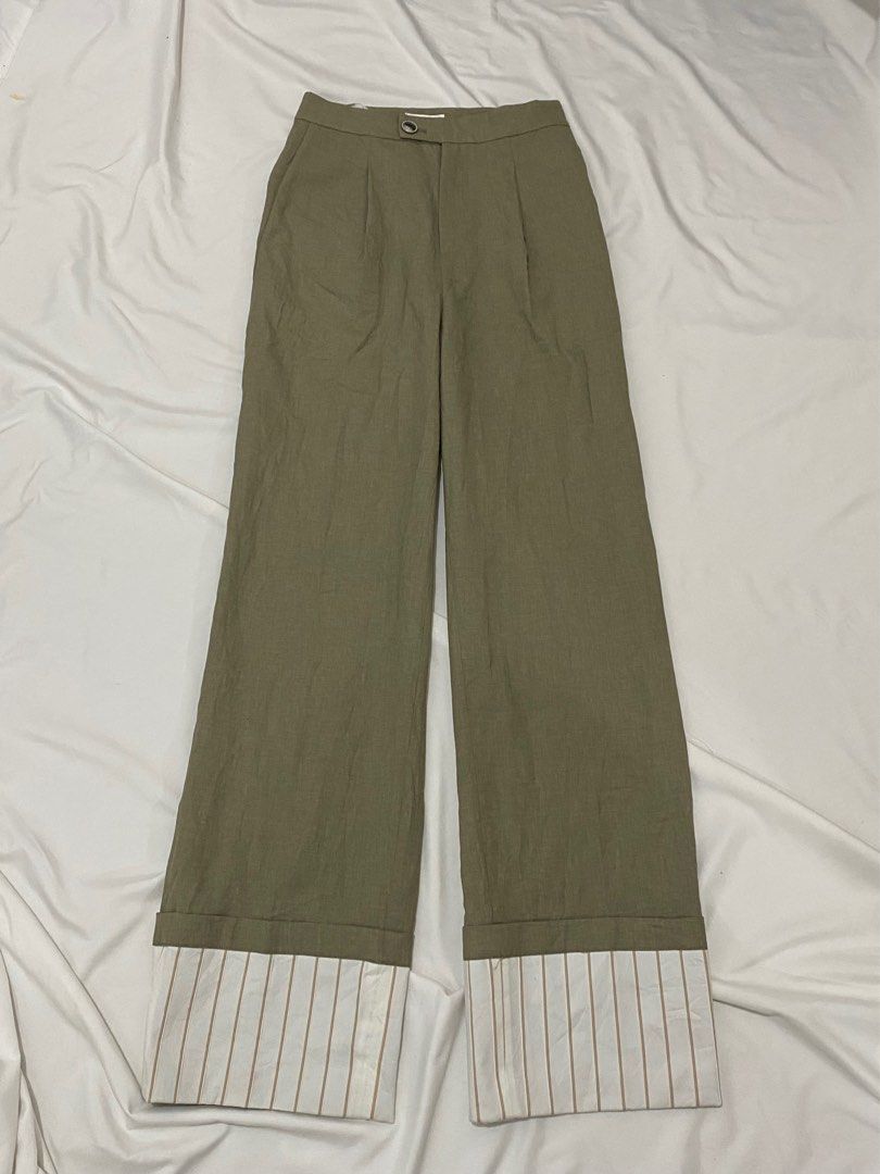 Miss Sixty Wide Leg Pants (Category: Jeans) located in Aliaga. Submitted by dudarling (Listing ID 1415173936, Image 1). Description: - Miss Sixty wide-leg pants - Unique design with contrasting striped cuff - Features Miss Sixty logo button closure - Muted green color - Striped interior lining - Perfect for a chic and fashionable look.