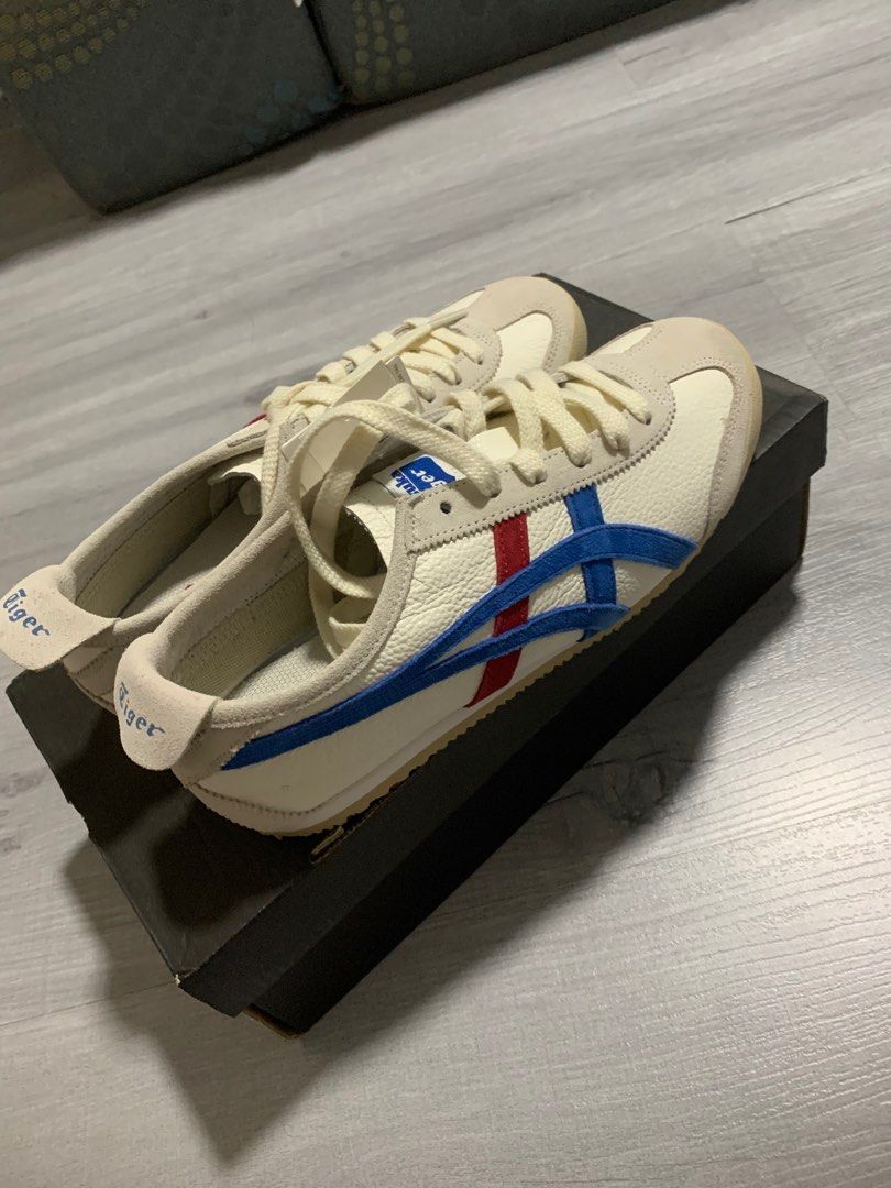 Onitsuka Tiger Mexico 66 - White/Blue/Red (Category: Sneakers) located in Cainta. Submitted by JCJ_shoppe (Listing ID 1415045681, Image 2). Description: - Onitsuka Tiger Mexico 66 sneakers - very excellent used condition - Color: White with blue and red stripes - Size: 37.5 EUR, 5 US, 23.5 CM - Features: - Cream-colored sole and laces - Onitsuka Tiger logo on tongue and heel - Includes original box - Made in Indonesia.