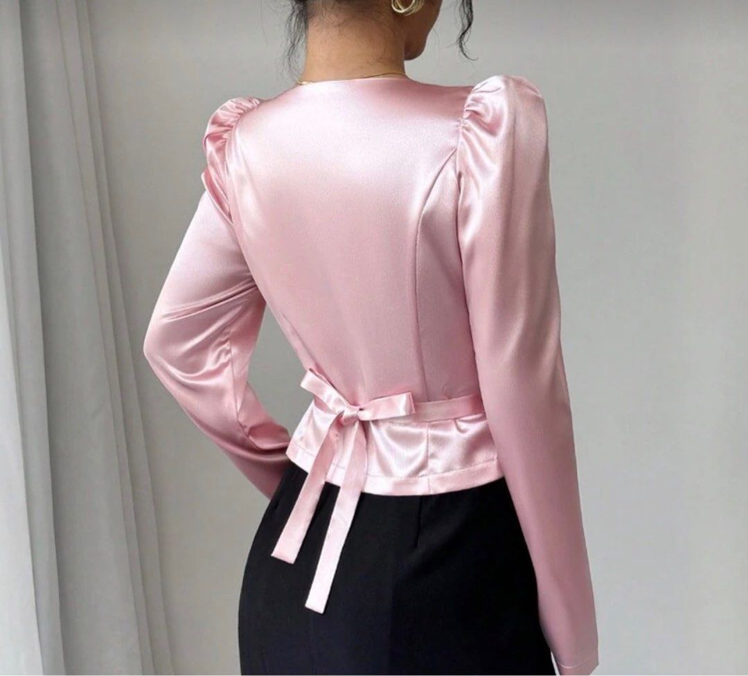 Pink Satin Puff Sleeve Blouse (Category: Blouses) located in Taguig. Submitted by httpgrant (Listing ID 1415222683, Image 2). Description: - NEVER WORN - Pink satin blouse - Puff sleeves - V-neckline - Button-down front - Tie back detail - Long sleeves - Perfect for a night out or special occasion.