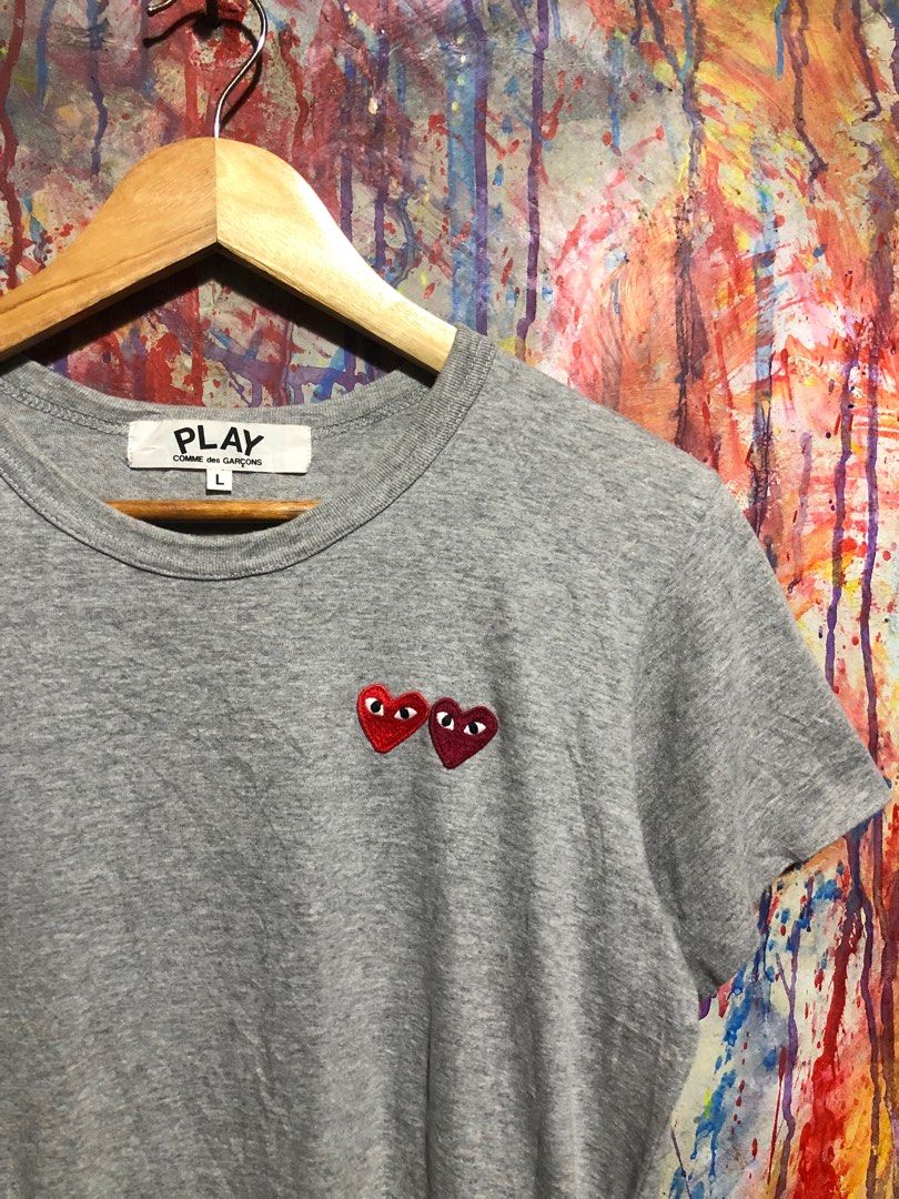 Play Comme des Garcons Double Heart Tshirt (Category: Luxury Apparel) located in Quezon City. Submitted by unholy_finds (Listing ID 1415094620, Image 3). Description: - Play Comme des Garcons T-shirt - Gray color - Size: L - Features the iconic Double heart logo - Made in Japan - Material: Cotton.