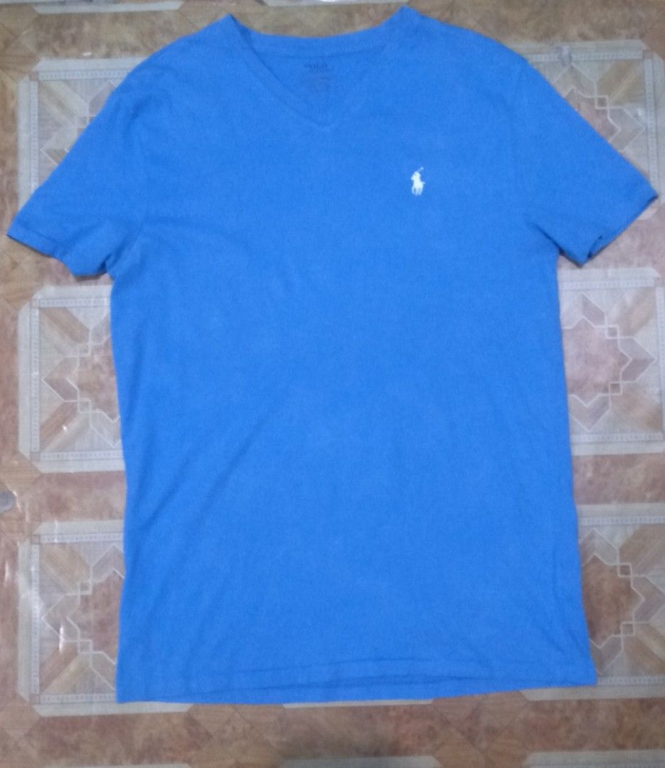 Polo by Ralph Lauren (Category: Tshirts & Polo Shirts ) located in Pila. Submitted by franklinsanity (Listing ID 1415153208, Image 1). Description: Dimension When laid flat Length - 27.5 inches width - 19 inches V-nech Small on tag but can fit medium built body Dm if interested.