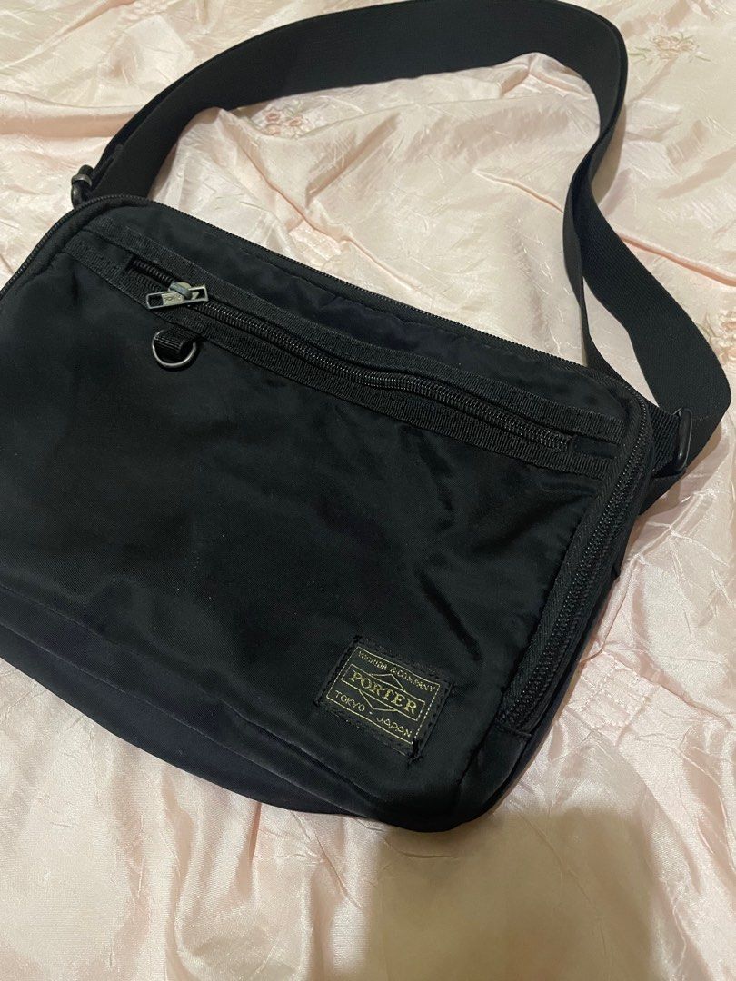 Porter Yoshida Tokyo Shoulder Bag (Category: Shoulder Bags) located in Tagum. Submitted by noobins (Listing ID 1415149008, Image 2). Description: - Black shoulder bag from Porter Tokyo - Main compartment and front zippered pocket - Adjustable shoulder strap - Includes a small metal ring - Features YKK zipper - Made in Japan no issues.