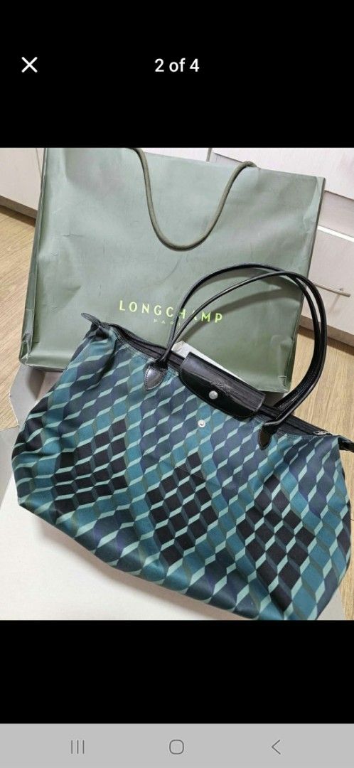 Prada Red Leather Tote Bag (Category: Luxury Bags & Wallets) located in Pasig City. Submitted by tatsiballs (Listing ID 1415194072, Image 3). Description: For sale all negotiable!!! offer lang kayo. Prada- 7k SOLD! SOLD! SOLD! Gucci- 14k Longchamp -4K.