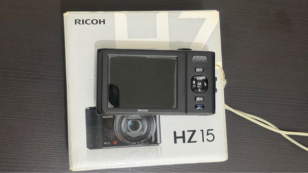 Ricoh HZ 15 Digicam (Category: Cameras) located in Valenzuela. Submitted by willrez (Listing ID 1415199904, Image 2). Description: Missing charger port cover Replacement battery.