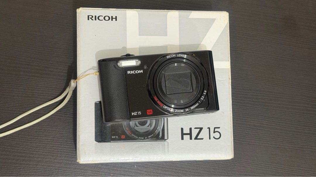 Ricoh HZ 15 Digicam (Category: Cameras) located in Valenzuela. Submitted by willrez (Listing ID 1415199904, Image 1). Description: Missing charger port cover Replacement battery.