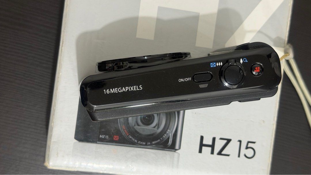 Ricoh HZ 15 Digicam (Category: Cameras) located in Valenzuela. Submitted by willrez (Listing ID 1415199904, Image 3). Description: Missing charger port cover Replacement battery.