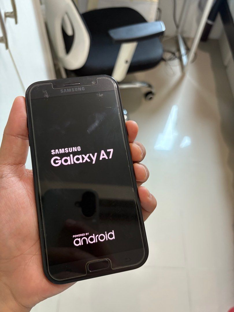 Samsung A7 (2017) (Category: Samsung) located in Mandaluyong City. Submitted by markydoromal (Listing ID 1415075156, Image 2). Description: Samsung A7 (2017) 32GB 70% Battery No defect. mabagal na siya compared sa new phones talaga and mabilis malowbatt (70%). Stickers residue lang ang nasa likod, not gasgas. Pwde pa punasan. Nagagamit pa talaga. Kaya selling at low price. RFS: Phone ng papa ko. May bago na siyang phone..