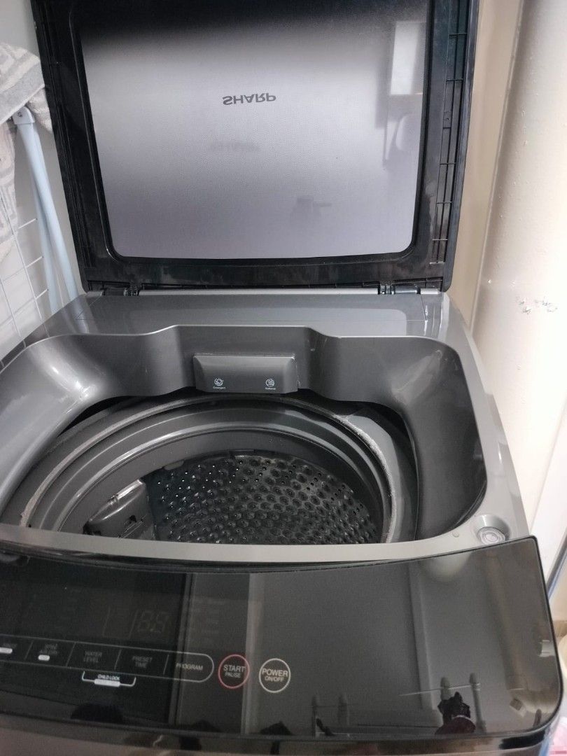 Sharp Top Load Washing Machine (Category: Washing Machines and Dryers) located in Singapore. Submitted by dimplesis (Listing ID 1415219081, Image 2). Description: BOUGHT IN NOV 2023 CONDITION STILL VERY GOOD NOTE:" Surface scratches on the tub rim, located on the grey plastic around the opening. Purely cosmetic and does not affect function" SELF COLLECT AT 654293 PRICE IS FIXED - Sharp top load washing machine - Energy-saving direct drive inverte