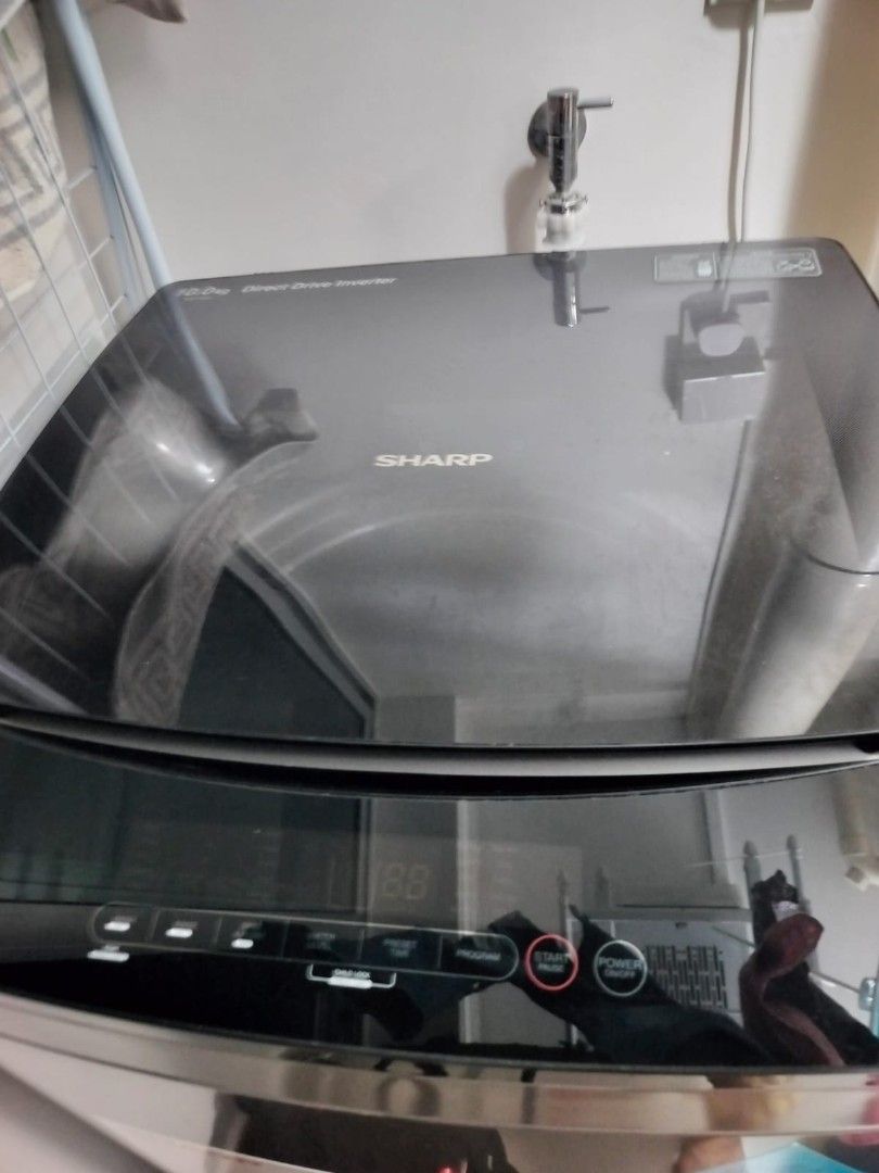 Sharp Top Load Washing Machine (Category: Washing Machines and Dryers) located in Singapore. Submitted by dimplesis (Listing ID 1415219081, Image 1). Description: BOUGHT IN NOV 2023 CONDITION STILL VERY GOOD NOTE:" Surface scratches on the tub rim, located on the grey plastic around the opening. Purely cosmetic and does not affect function" SELF COLLECT AT 654293 PRICE IS FIXED - Sharp top load washing machine - Energy-saving direct drive inverte