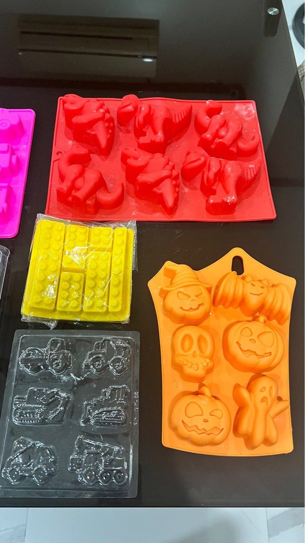 Silicone Molds - Various Shapes (Category: Cookware & Accessories) located in Quezon City. Submitted by closetcleanupfairy (Listing ID 1415086311, Image 3). Description: - Silicone molds for chocolates, candies, and more! - Includes molds of vehicles, dinosaurs, Halloween figures, and building blocks. .