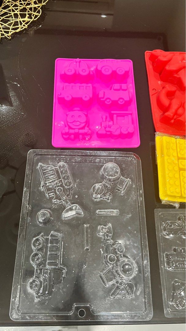 Silicone Molds - Various Shapes (Category: Cookware & Accessories) located in Quezon City. Submitted by closetcleanupfairy (Listing ID 1415086311, Image 2). Description: - Silicone molds for chocolates, candies, and more! - Includes molds of vehicles, dinosaurs, Halloween figures, and building blocks. .