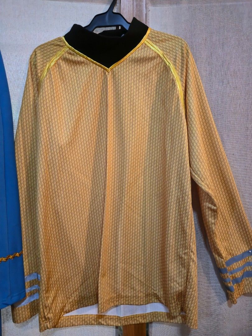 Star Trek Uniform Costume Set (Category: Dresses) located in Pasig City. Submitted by leildyne (Listing ID 1415163491, Image 2). Description: - Two Star Trek uniform costumes available. - One blue uniform with gold emblem and trim. - One yellow uniform with blue stripes on the sleeves. - Both uniforms feature black collars. - Both uniforms are long-sleeved..