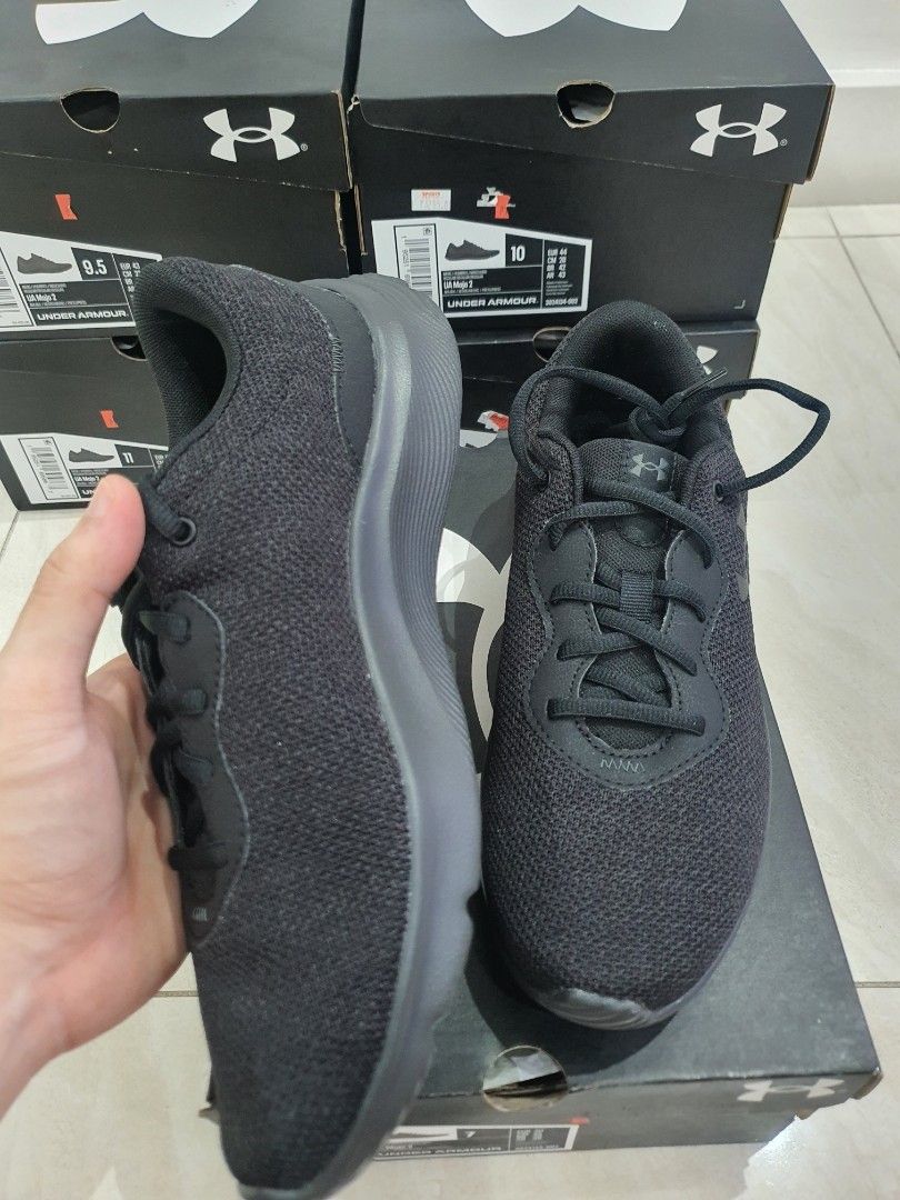 Under Armour Mojo 2 Black Running Shoes (Category: Sneakers) located in Manila. Submitted by deancchiu (Listing ID 1415049584, Image 2). Description: - Under Armour Pursuit 2 running shoes - Sizes: 7/8/8.5/9/9.5/10/10.5/11/11.5/12 - Price starts at 1300 - Color: Black - Includes original box - Unworn condition - Unique sole pattern for grip - Size visible on box - Ideal for running and everyday use.