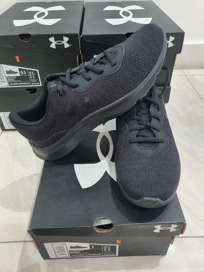 Under Armour Mojo 2 Black Running Shoes (Category: Sneakers) located in Manila. Submitted by deancchiu (Listing ID 1415049584, Image 3). Description: - Under Armour Pursuit 2 running shoes - Sizes: 7/8/8.5/9/9.5/10/10.5/11/11.5/12 - Price starts at 1300 - Color: Black - Includes original box - Unworn condition - Unique sole pattern for grip - Size visible on box - Ideal for running and everyday use.