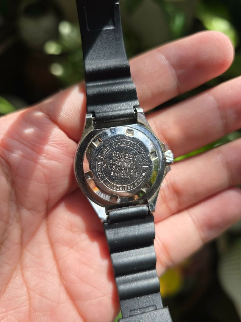 Vintage Citizen Challenge Diver 150M watch (Category: Men's Watches) located in Manila. Submitted by timearcph (Listing ID 1415183530, Image 3). Description: This is a vintage Citizen Challenge Diver 150M watch. The watch features a black dial and a black unidirectional rotating bezel. It has a water resistance rating of 150 meters. The watch is powered by a quartz movement. It includes a day-date complication, displaying "SAT 14" in the image. S
