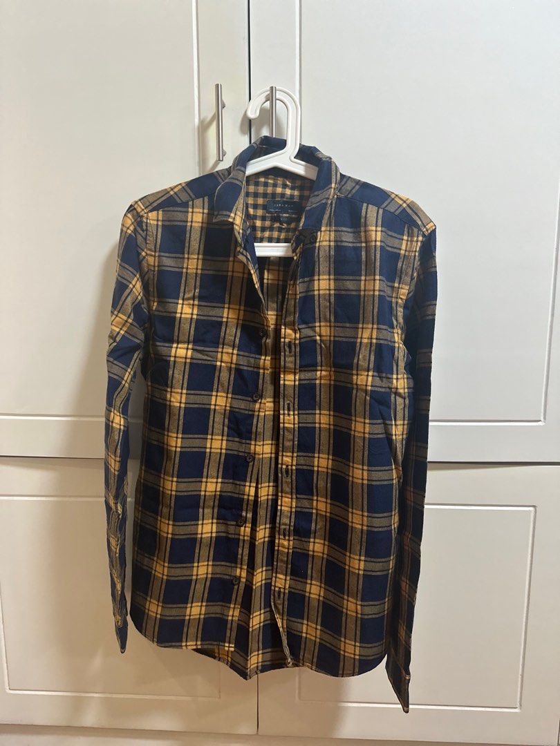 Zara Man Plaid Shirt (Category: Tshirts & Polo Shirts ) located in Manila. Submitted by ailas (Listing ID 1415104098, Image 1). Description: - Zara Man plaid shirt - Color: Navy blue and yellow - Features: Button-down front, long sleeves, collared neckline - Material: Flannel - Fit: Slim.