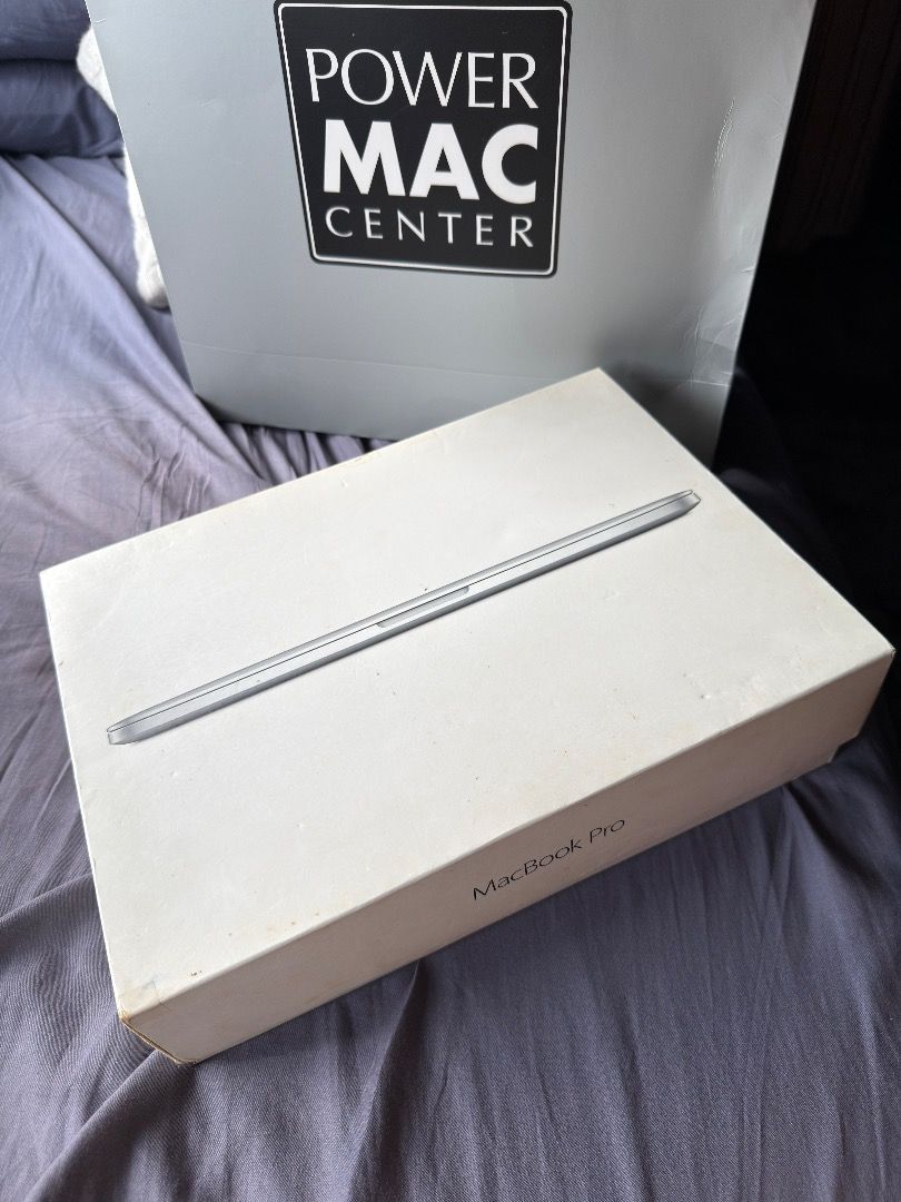 Apple Macbook Pro 13in 2014 (Complete set) (Category: Laptops & Notebooks) located in Makati City. Submitted by KambyoIde (Listing ID 1415260935, Image 2). Description: Selling my Apple Macbook Pro 13in 2014 - Inclusion: Complete with Box, PMC Paper bag, Charger, Extension cord, Keyboard cover and Acrylic Case. - Selling for only P4,000 - Condition: Battery needs replacement to open it, not working even plug. - Cycle count: 900+ - Reason to sell:
