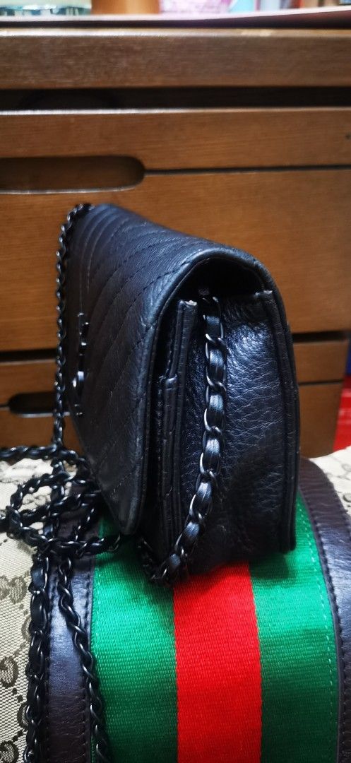 YSL Black Quilted Shoulder Bag with Chain Strap (Category: Shoulder Bags) located in Cainta. Submitted by phengaying (Listing ID 1415369168, Image 2). Description: - Black quilted shoulder bag - Features a chain strap - Classic flap closure - Crafted from leather - Includes a side pocket -mini size, fits a cp or compact wallet Flaws: minor scratching on leather. Minor interior peeling/cracks.