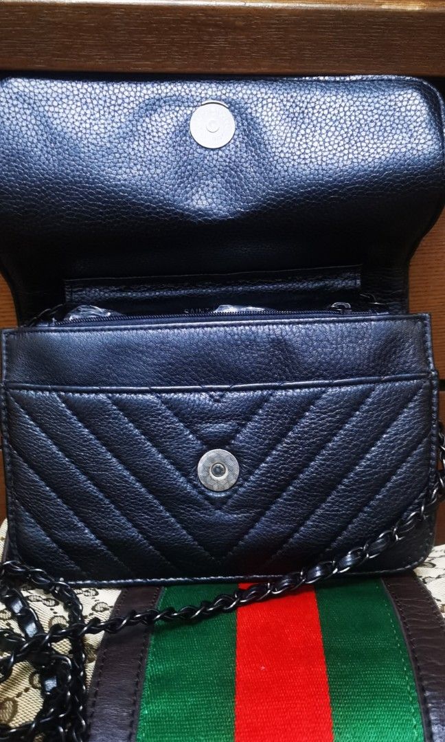YSL Black Quilted Shoulder Bag with Chain Strap (Category: Shoulder Bags) located in Cainta. Submitted by phengaying (Listing ID 1415369168, Image 3). Description: - Black quilted shoulder bag - Features a chain strap - Classic flap closure - Crafted from leather - Includes a side pocket -mini size, fits a cp or compact wallet Flaws: minor scratching on leather. Minor interior peeling/cracks.