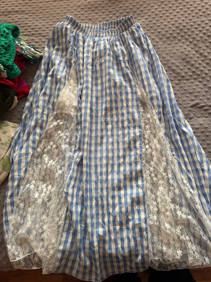 Blue Gingham Maxi Skirt with Lace (Category: Skirts) located in Muntinlupa City. Submitted by ycslash98 (Listing ID 1415278047, Image 1). Description: - Blue and white gingham maxi skirt - Delicate white lace panels - Comfortable elastic waistband - Lightweight and flowy fabric - Perfect for casual outings - Made of soft, breathable fabric.