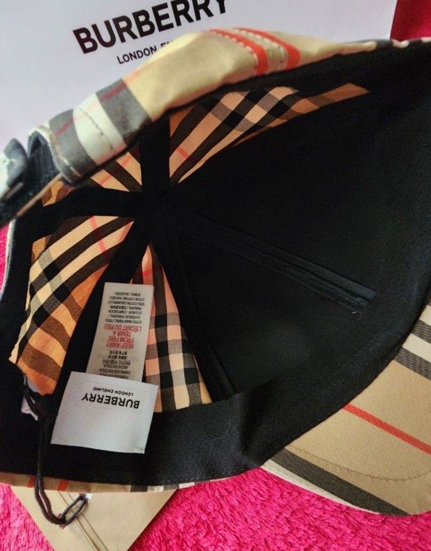 Burberry Checkered Cap (Category: Caps & Hats) located in Manila. Submitted by microus (Listing ID 1415280449, Image 3). Description: - Authentic Burberry cap - Iconic checkered pattern - Beige color with black and red accents - Curved brim - Adjustable strap - Includes tag - Comes with Burberry paper bag.