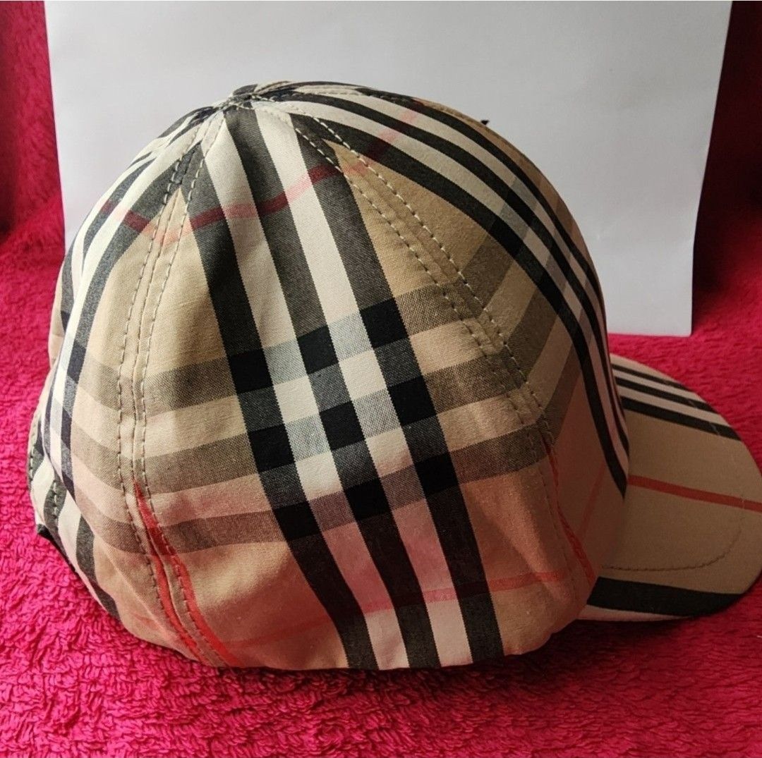 Burberry Checkered Cap (Category: Caps & Hats) located in Manila. Submitted by microus (Listing ID 1415280449, Image 2). Description: - Authentic Burberry cap - Iconic checkered pattern - Beige color with black and red accents - Curved brim - Adjustable strap - Includes tag - Comes with Burberry paper bag.