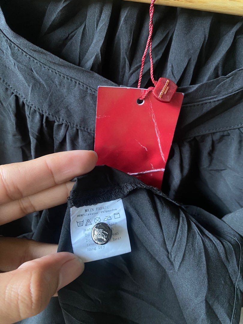 Burberry London Black Blouse (Category: Blouses) located in Tuguegarao City. Submitted by thriftnigelo (Listing ID 1415250902, Image 3). Description: - Authentic Burberry London blouse - Color: Black - Size: M - Design: Button-down, three-quarter sleeves - Material: 96% polyester, 4% spandex - Burberry logo present.