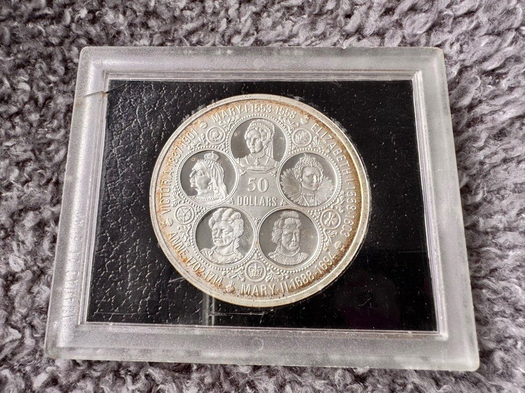 Cayman Islands 50 Dollars Coin 1976 (Category: Currency) located in Manila. Submitted by flojo1220 (Listing ID 1415277849, Image 1). Description: - collectible coins for sale. - 1976 Cayman Islands coin featuring Queen Elizabeth II. - back indicates 50 dollars with portraits of five queens: Victoria, Mary I, Elizabeth I, Anne, and Mary II. - encased in protective holder - sealed, never opened.