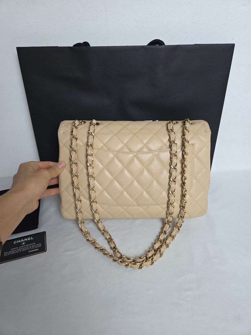 Chanel Classic Flap Bag Beige (Category: Luxury Bags & Wallets) located in Angeles City. Submitted by nikki.tan444 (Listing ID 1415333854, Image 2). Description: - Chanel Classic Flap Bag - Beautiful beige color - Iconic diamond quilting - Gold-tone chain strap - Includes dust bag and authenticity card - Minimal signs of wear - Perfect for any occasion.