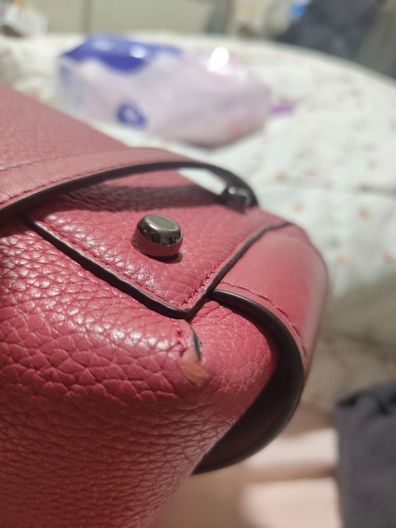 Coach Brooklyn 28 CarryAll bag (Category: Luxury Bags & Wallets) located in Paranaque City. Submitted by nicel10 (Listing ID 1415301919, Image 2). Description: - Pink Coach satchel handbag - Top handles and detachable shoulder strap - Zip closure - Pebbled leather exterior - Fabric-lined interior with slip pocket - Metal feet on the bottom - Minor wear on corners and handles - Coach logo and serial number (J1621-56839) More details: -missing tag 