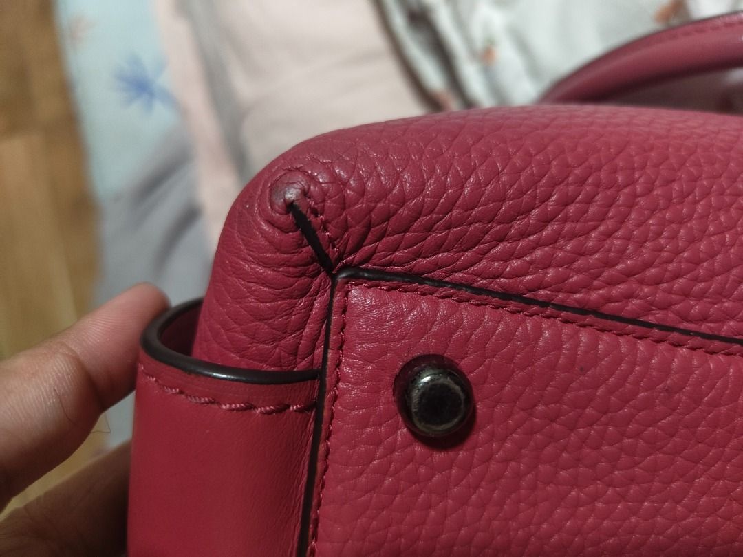 Coach Brooklyn 28 CarryAll bag (Category: Luxury Bags & Wallets) located in Paranaque City. Submitted by nicel10 (Listing ID 1415301919, Image 3). Description: - Pink Coach satchel handbag - Top handles and detachable shoulder strap - Zip closure - Pebbled leather exterior - Fabric-lined interior with slip pocket - Metal feet on the bottom - Minor wear on corners and handles - Coach logo and serial number (J1621-56839) More details: -missing tag 