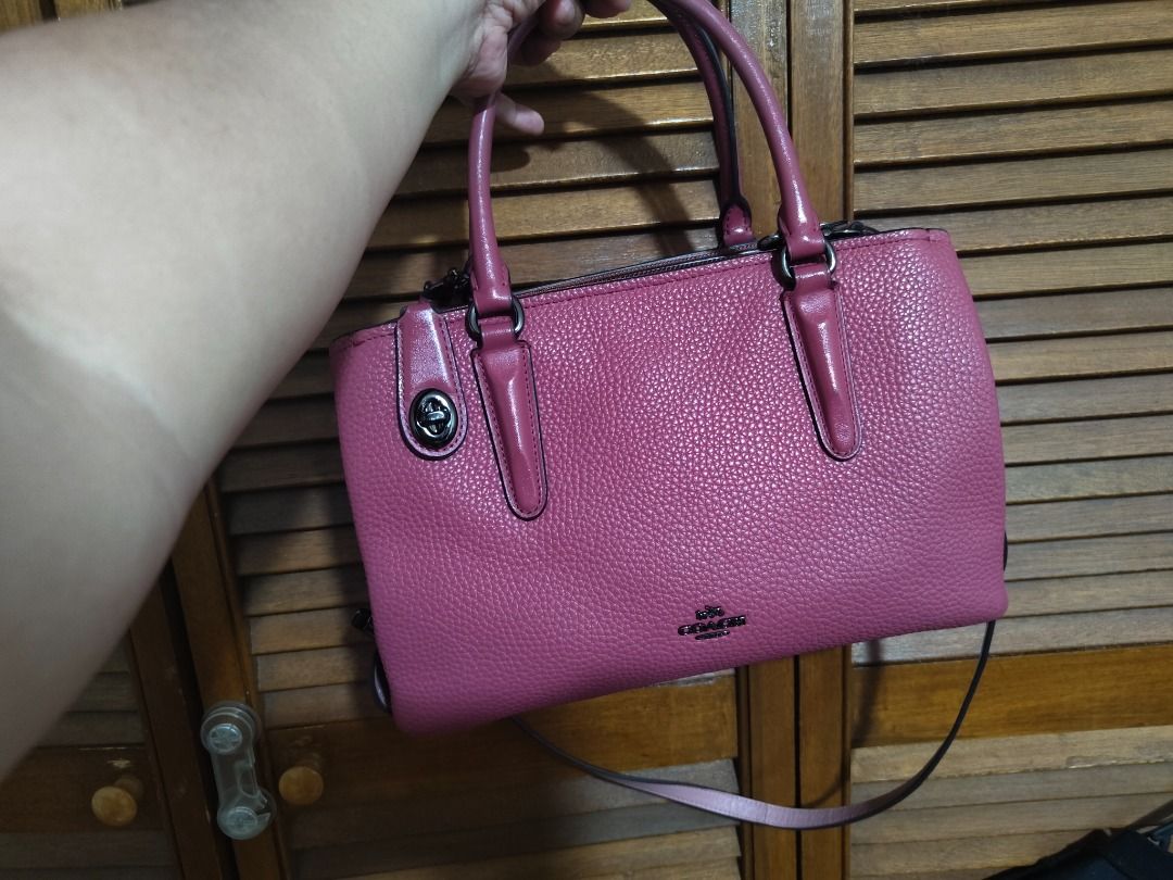 Coach Brooklyn 28 CarryAll bag (Category: Luxury Bags & Wallets) located in Paranaque City. Submitted by nicel10 (Listing ID 1415301919, Image 1). Description: - Pink Coach satchel handbag - Top handles and detachable shoulder strap - Zip closure - Pebbled leather exterior - Fabric-lined interior with slip pocket - Metal feet on the bottom - Minor wear on corners and handles - Coach logo and serial number (J1621-56839) More details: -missing tag 
