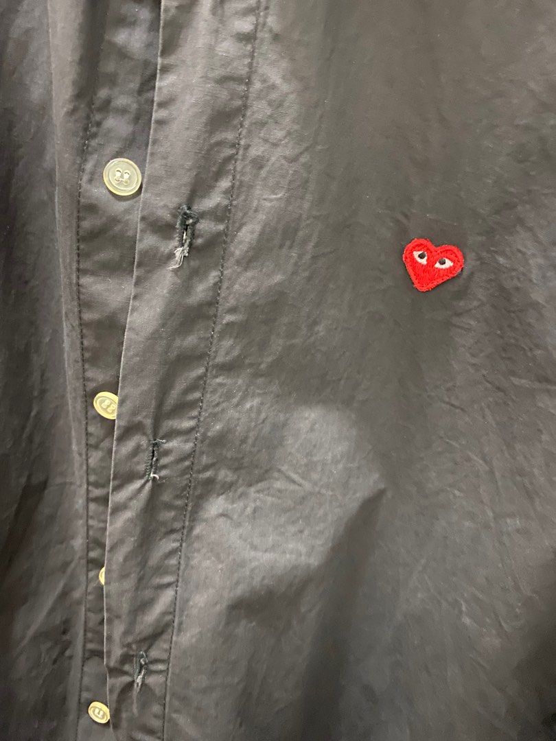 comme des garcons long sleeve black polo (Category: Coats, Jackets and Outerwear) located in Makati City. Submitted by celebrityauctions (Listing ID 1415334992, Image 3). Description: The shirt shown is a Comme des Garçons Play heart logo shirt. This specific item is a black, long-sleeve, button-down shirt featuring the brand’s iconic small red heart emblem with eyes embroidered on the chest. Product Details Brand: Comme des Garçons Play (CDG Pla