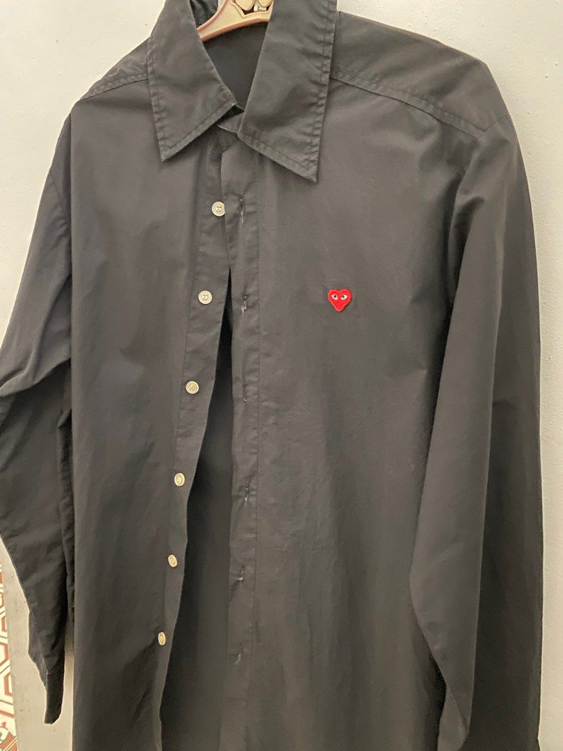 comme des garcons long sleeve black polo (Category: Coats, Jackets and Outerwear) located in Makati City. Submitted by celebrityauctions (Listing ID 1415334992, Image 2). Description: The shirt shown is a Comme des Garçons Play heart logo shirt. This specific item is a black, long-sleeve, button-down shirt featuring the brand’s iconic small red heart emblem with eyes embroidered on the chest. Product Details Brand: Comme des Garçons Play (CDG Pla