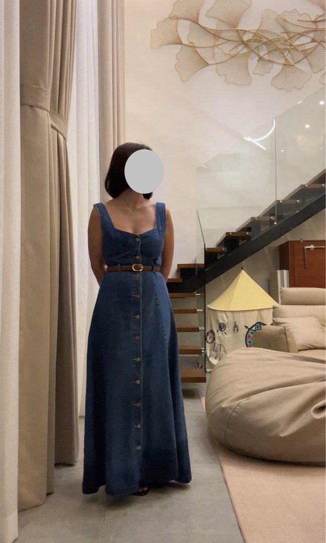 Denim Maxi Dress with Belt (Category: Dresses) located in Manila. Submitted by gettybyrina (Listing ID 1409132582, Image 2). Description: Used 3x. Denim maxi dress features a button-down front, a square neckline, and a matching belt to cinch the waist. It has a sleeveless design and a flowing skirt. It is a versatile piece suitable for various occasions. Helping tags 🏷️ Bershka Zara Mango .