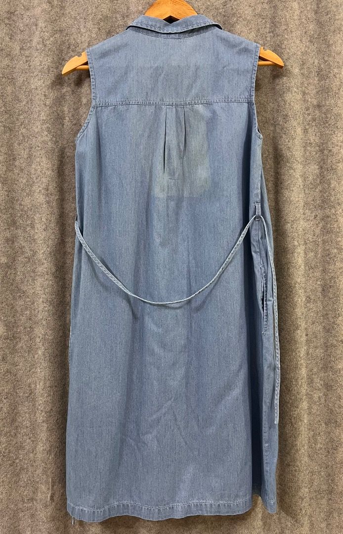 Denim Sleeveless Maternity Dress - Medium (Category: Maternity wear) located in Taguig. Submitted by plvlilo (Listing ID 1415280196, Image 3). Description: - Sleeveless denim dress - Collared neckline - Button-down front - Tie-waist detail at back - Side slits for added comfort - Light-wash denim - With two side pockets.