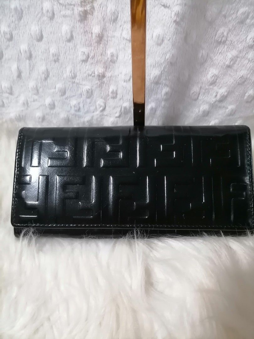 Fendi Black Wallet (Category: Luxury Bags & Wallets) located in Butuan. Submitted by az-branded.items (Listing ID 1415423823, Image 1). Description: - Fendi wallet - Black leather with embossed Fendi logo - Multiple card slots and bill compartments - Snap closure - Gold Fendi logo inside - Minimal signs of wear- visible yung dikit parang may tinanggal pero nasa loob lang hindi napo kita. -No code seen -Selling low -From Korean surplus .