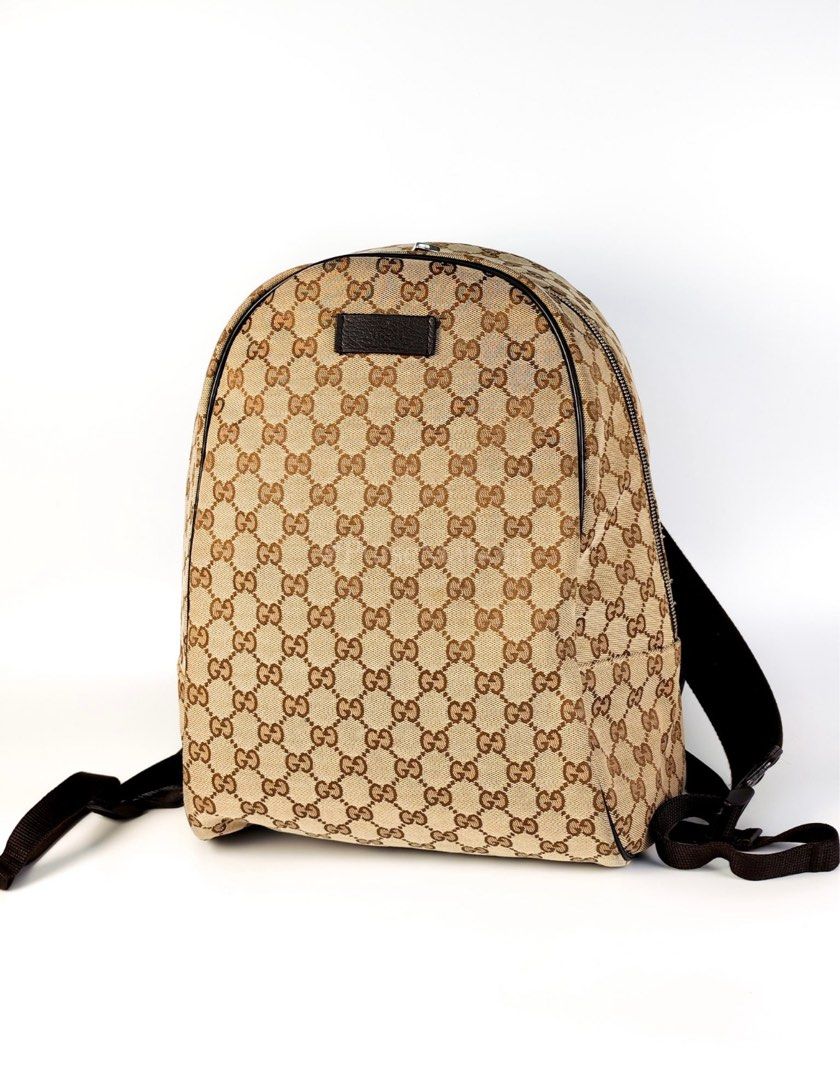 Gucci Backpack in Beige GG Supreme Canvas (Category: Luxury Bags & Wallets) located in Taguig. Submitted by closetcompany (Listing ID 1415320932, Image 2). Description: Gucci Backpack in Beige GG Supreme Canvas Price: Php 42,000.00 Condition: Excellent (9/10) Exterior: Minor lint on canvas, minor scuffs on the leather Interior: Mild signs of usage. Hardware: Hairline scratches. Inclusions: Generic Dust Bag. Entrupy Certificate of Authenticity. 10