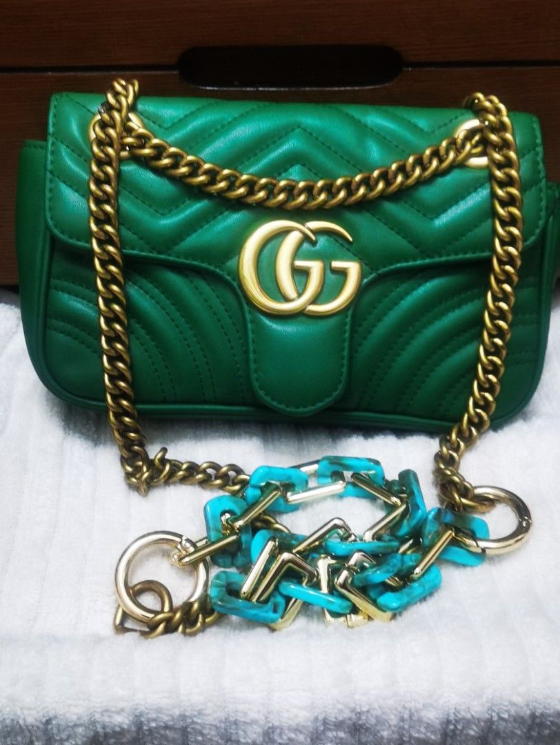 Gucci GG Marmont small Bag Green (Category: Luxury Bags & Wallets) located in Cainta. Submitted by phengaying (Listing ID 1415340649, Image 1). Description: - Gucci GG Marmont Mini Bag - Color: Green - Chain strap with turquoise accents - Flap closure with gold-tone clasp - Interior pocket with Gucci label - Serial number: 446744 101010 & black QR tag -RANK B condition FLAws: - leather damage/tear near the flap -replaced with resin chain extensio