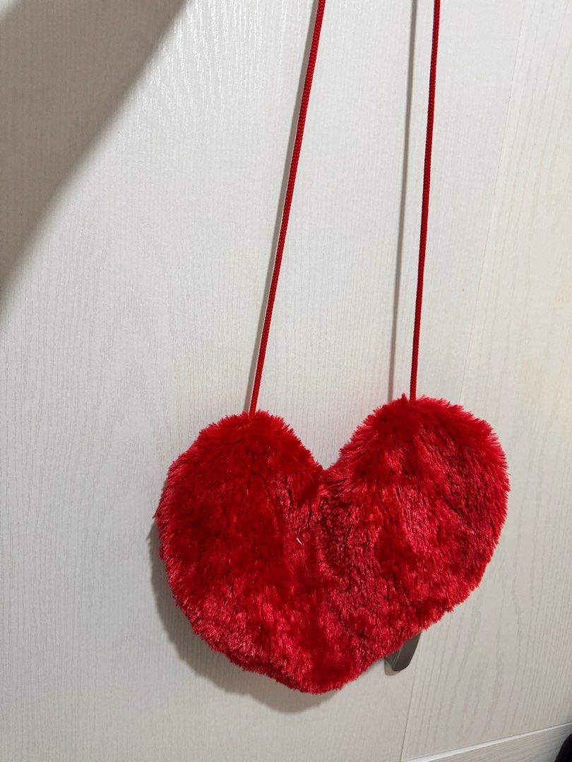 Heart-Shaped Red Sling Bag (Category: Cross-body Bags) located in Mandaluyong City. Submitted by bufifinds (Listing ID 1415352198, Image 1). Description: Heart sling bag .