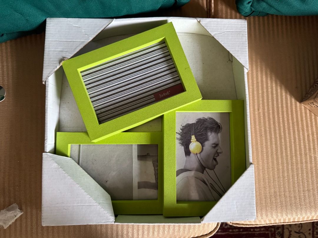 Lime Green Multi-Photo Frame Set (Category: Frames & Pictures) located in Muntinlupa City. Submitted by jay826 (Listing ID 1415290147, Image 1). Description: Set of lime green photo frames. It includes three frames of different sizes. One frame has a black and white striped design, and another has a picture of a man with headphones. The frames are in a cardboard box. Perfect for displaying your favorite photos! payment: gcash or COD.