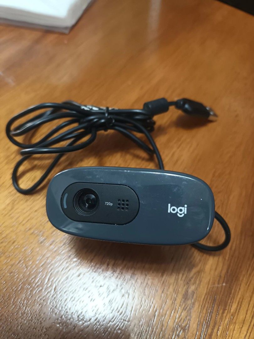 Logitech C270 HD Webcam (Category: Webcams) located in San Juan City. Submitted by solnbart (Listing ID 1415279918, Image 1). Description: - Logitech webcam - Built-in microphone - Dark gray color - Black cable - Logitech logo present - Lens at the bottom.