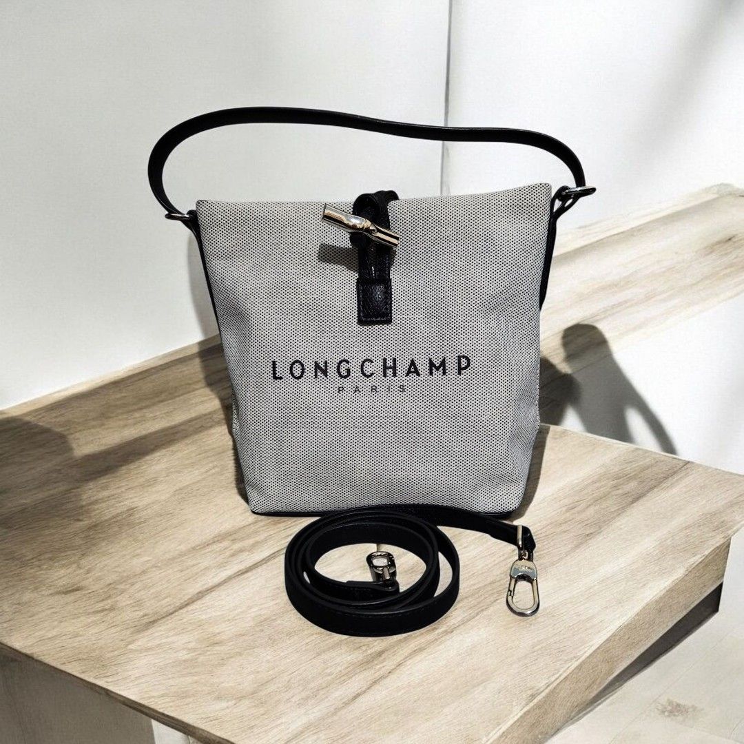 Longchamp Le Pliage Cuir Handbag (Category: Luxury Bags & Wallets) located in Mabini. Submitted by wearandcarry (Listing ID 1415298850, Image 1). Description: - Longchamp mesh handbag - Top handle and detachable shoulder strap - Black leather trim - Silver-tone clasp - Longchamp logo on the front - Bucket style design.
